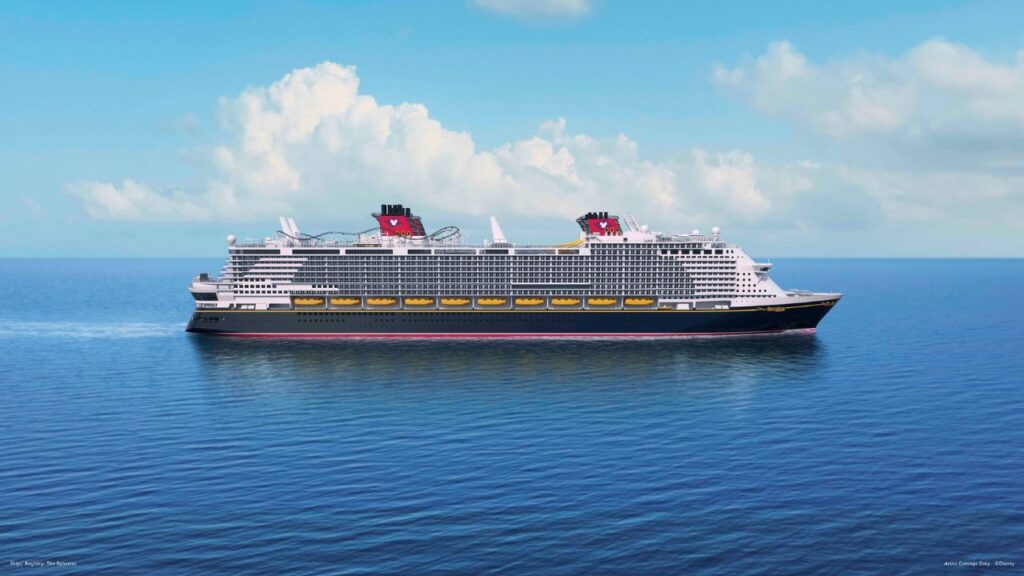 A large cruise ship with red and black funnels sails on a calm blue sea under a partly cloudy sky.